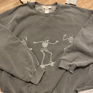 grey crewneck with skeletons on it